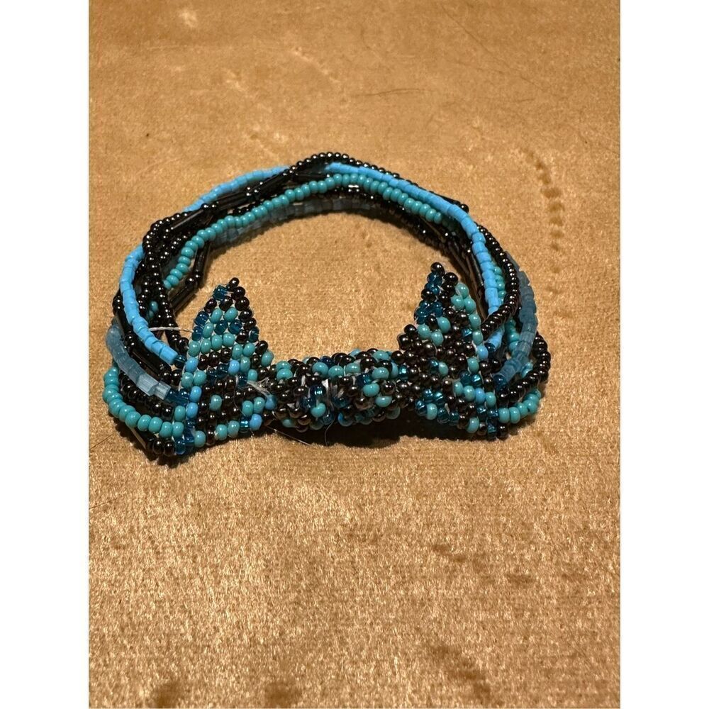 Beaded multi strand bow bracelet